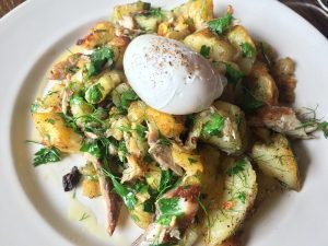 Poached egg on trout & potatoes