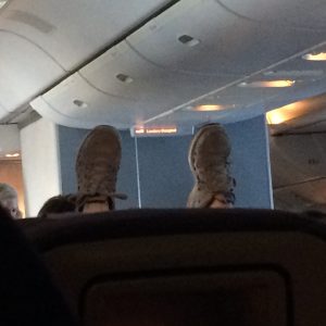 Lady a few rows ahead with her feet up, giving zero fucks