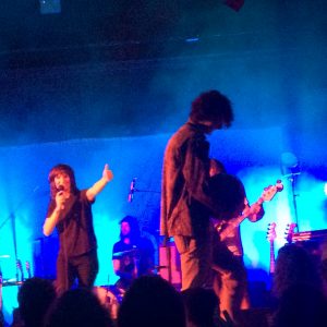 Jen Cloher giving the thumbs-up to the watermelon-laden contest winner